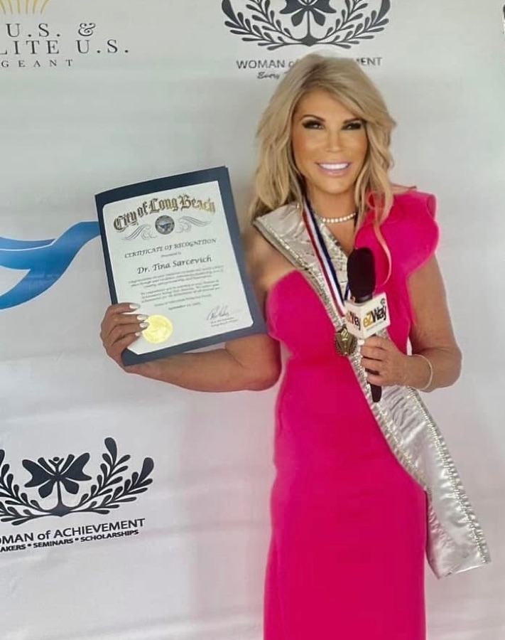 Dr. Tina being honored at a Woman of Achievement event